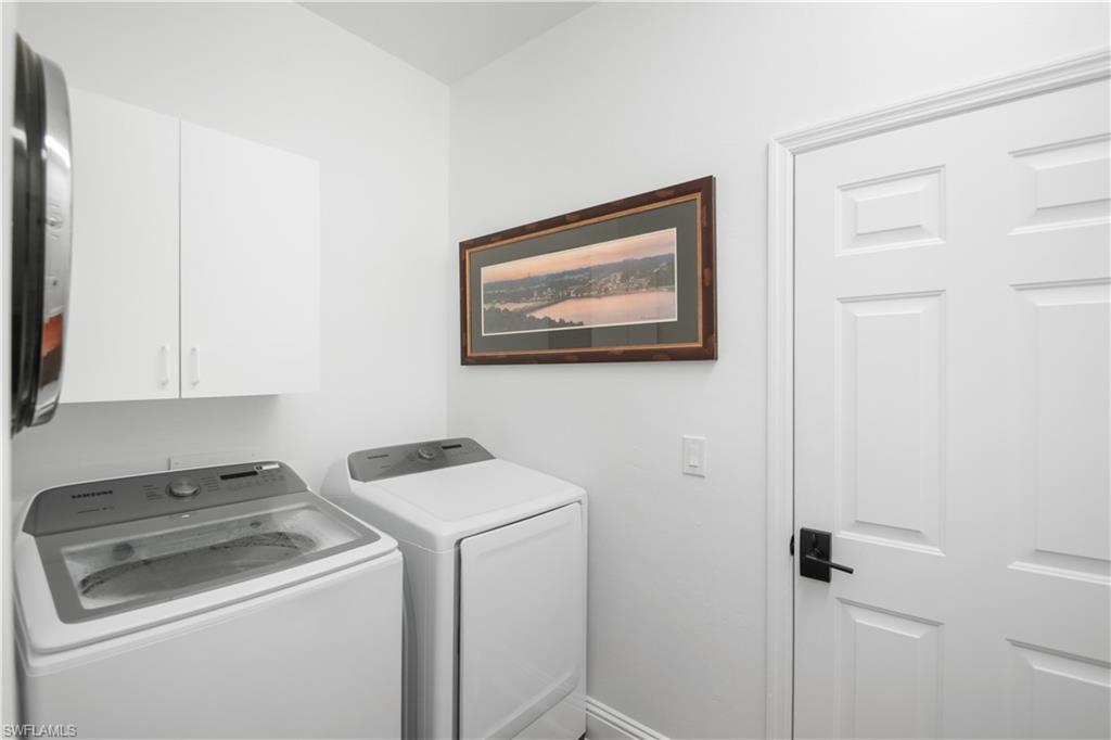 172 Eveningstar Cay Naples, FL 34114 - Photo 15 of 24 a view of storage and utility room with washer and dryer