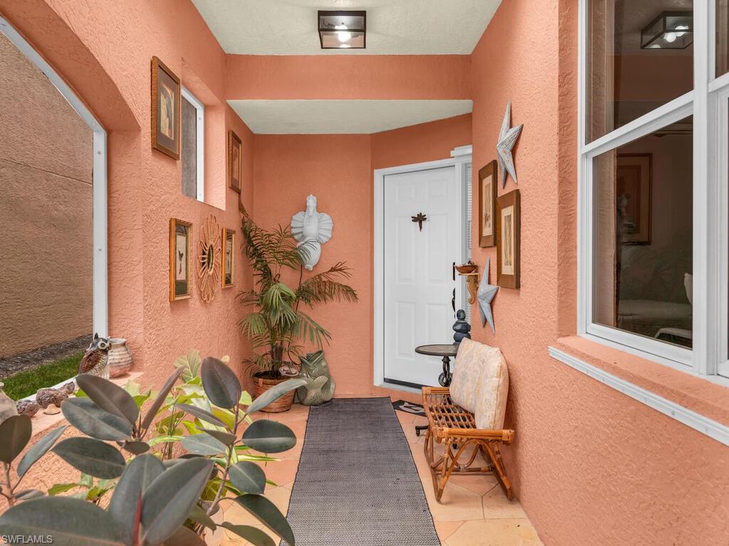 172 Eveningstar Cay Naples, FL 34114 - Photo 19 of 24 view of living room with patio