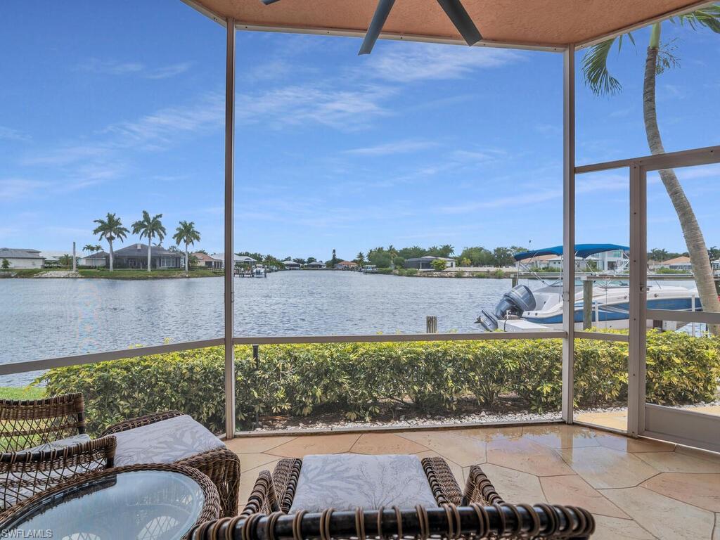 172 Eveningstar Cay Naples, FL 34114 - Photo 2 of 24 a view of a balcony with lake view and mountain view