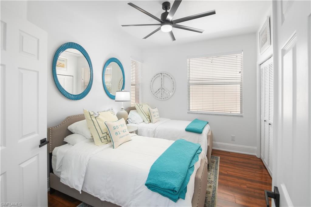 172 Eveningstar Cay Naples, FL 34114 - Photo 9 of 24 a bedroom with bed and a window