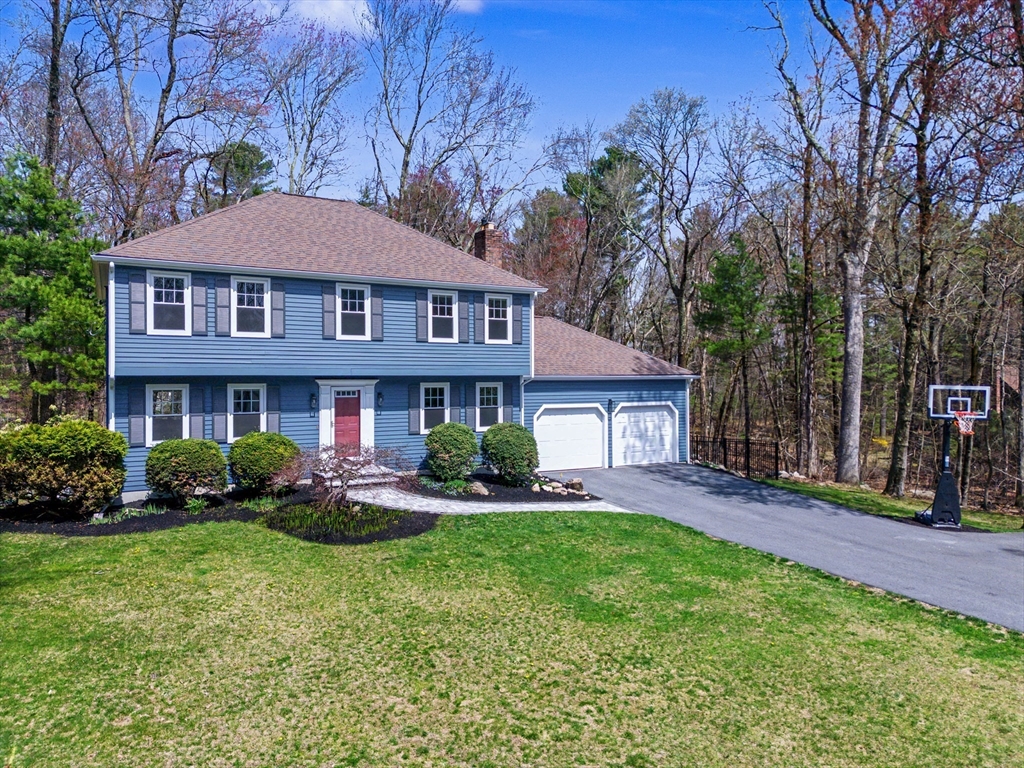 1 Coburn Road Hopkinton, MA 01748 - Photo 1 of 42 a front view of a house with a yard and potted plants