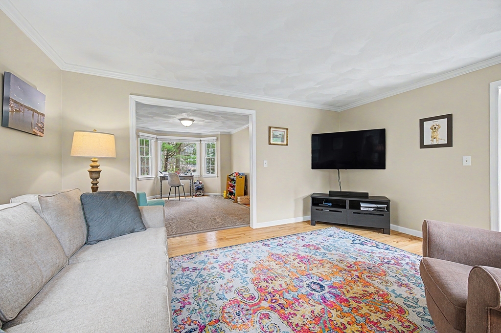 1 Coburn Road Hopkinton, MA 01748 - Photo 12 of 42 a living room with furniture and a flat screen tv