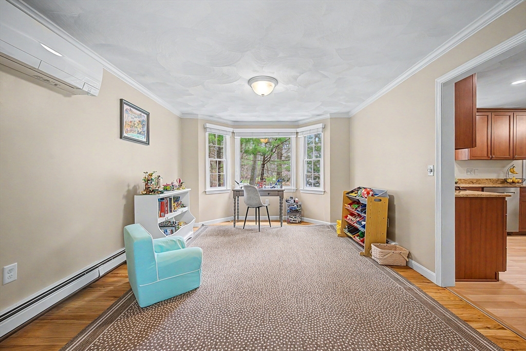 1 Coburn Road Hopkinton, MA 01748 - Photo 13 of 42 a view of a livingroom with furniture and a ceiling fan
