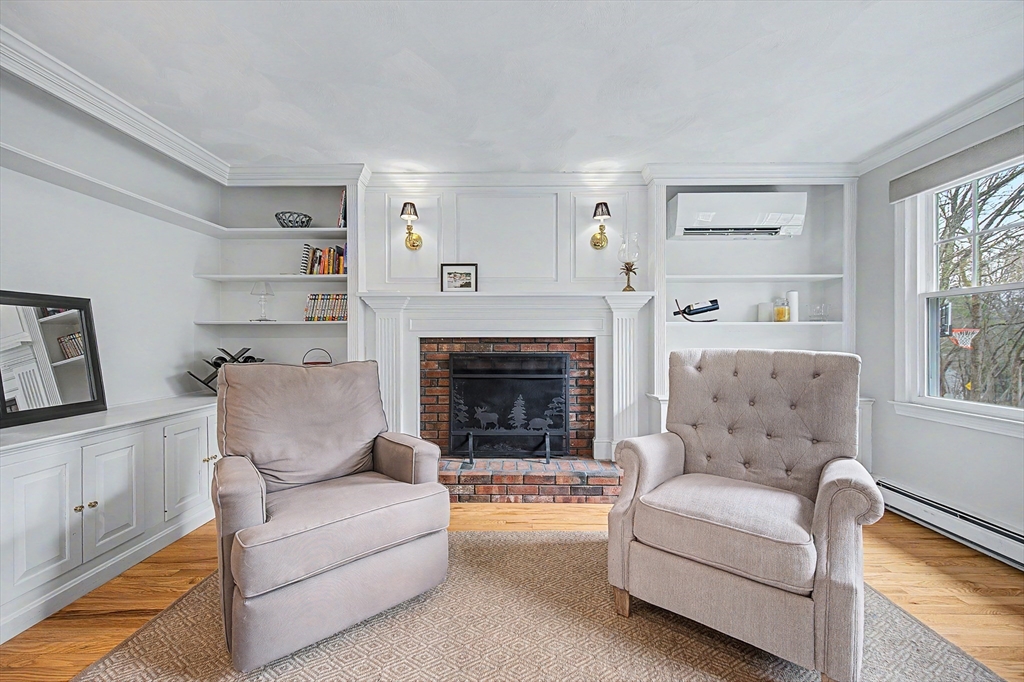 1 Coburn Road Hopkinton, MA 01748 - Photo 16 of 42 a living room with furniture and a fireplace