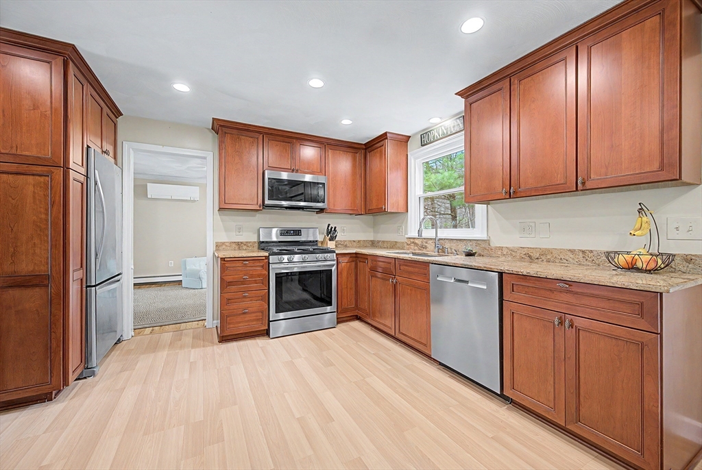 1 Coburn Road Hopkinton, MA 01748 - Photo 2 of 42 a kitchen with stainless steel appliances granite countertop a refrigerator stove and sink