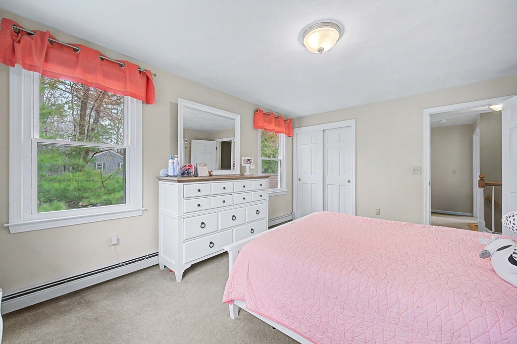 1 Coburn Road Hopkinton, MA 01748 - Photo 21 of 42 a bedroom with a bed and a dresser