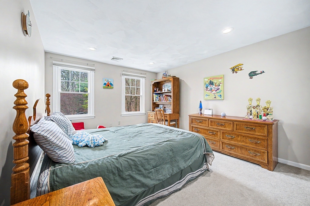 1 Coburn Road Hopkinton, MA 01748 - Photo 24 of 42 a bedroom with a bed and wooden floor