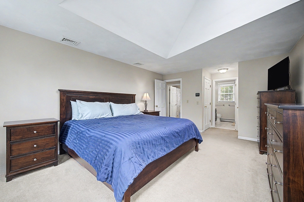 1 Coburn Road Hopkinton, MA 01748 - Photo 29 of 42 a bedroom with a bed and a tv