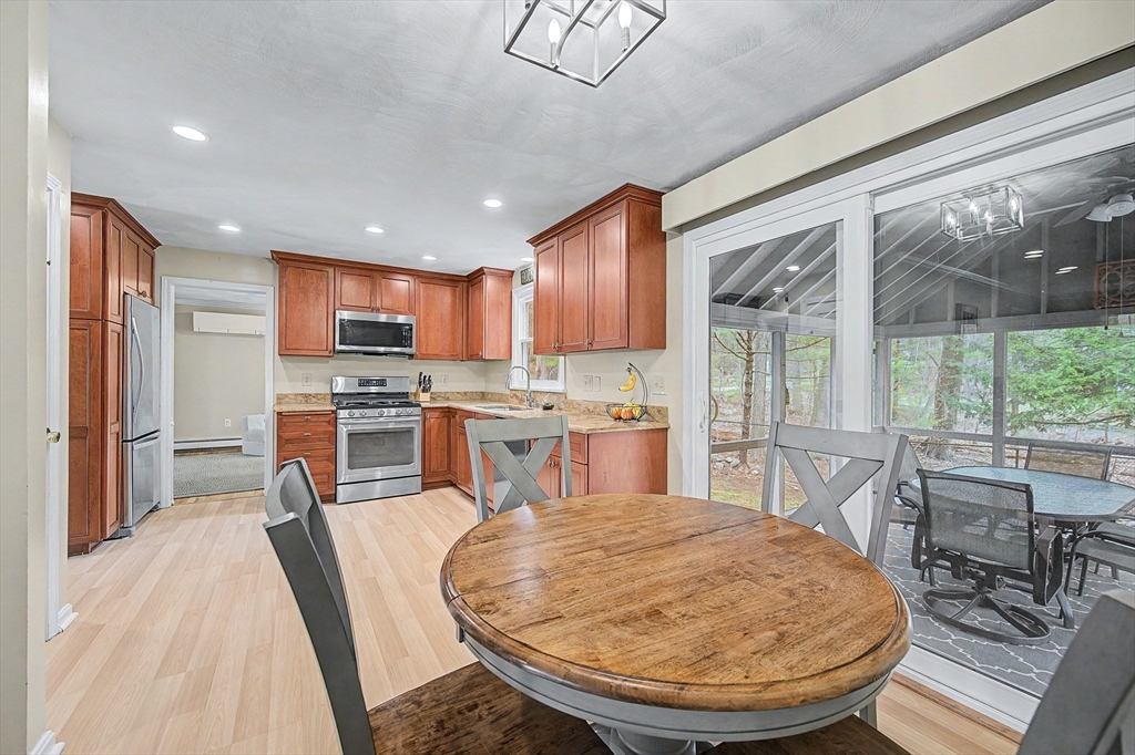 1 Coburn Road Hopkinton, MA 01748 - Photo 3 of 42 a kitchen with sink a refrigerator and chairs