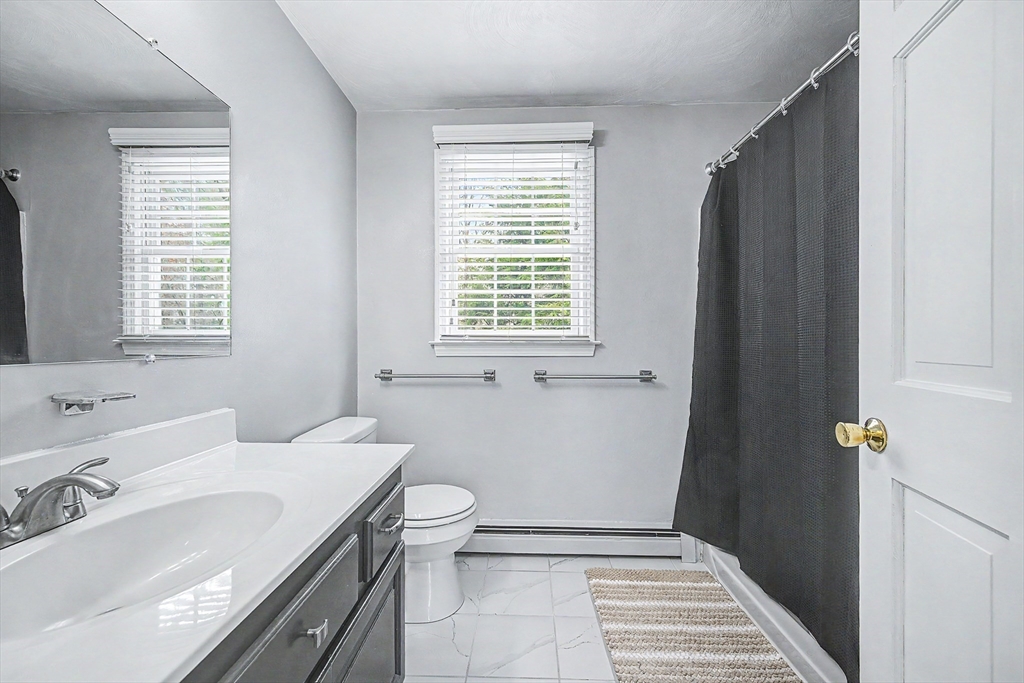 1 Coburn Road Hopkinton, MA 01748 - Photo 31 of 42 a bathroom with a sink toilet and tub