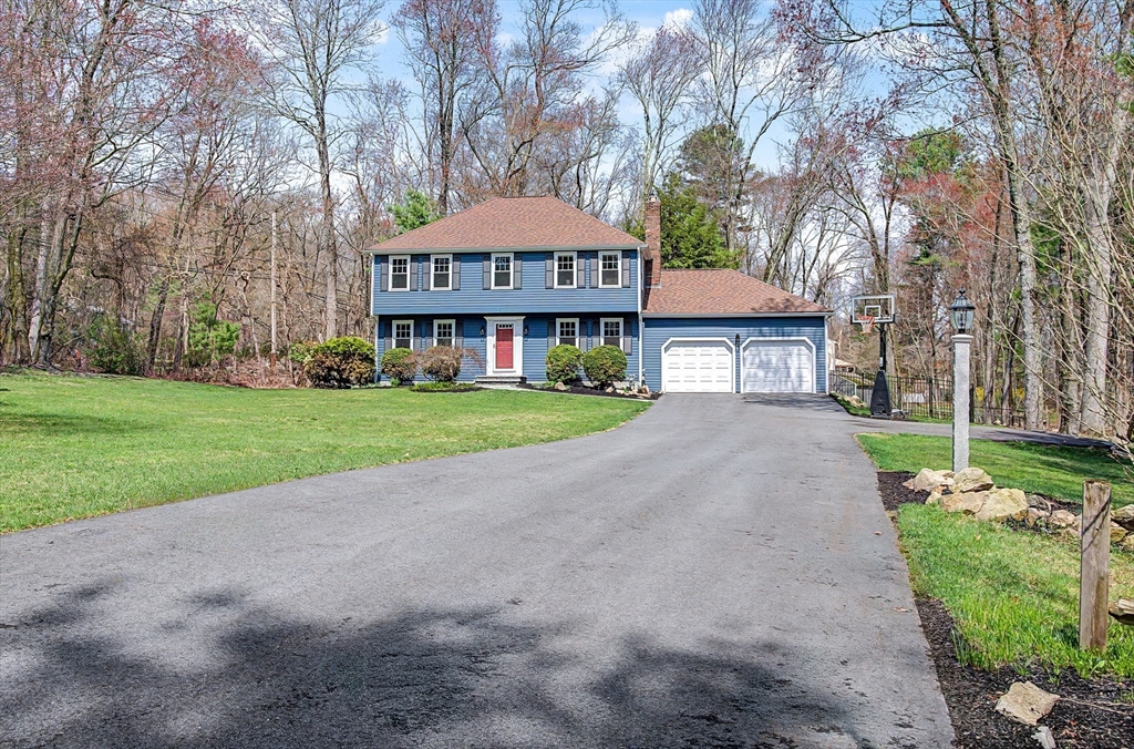 1 Coburn Road Hopkinton, MA 01748 - Photo 40 of 42 a front view of a house with a yard