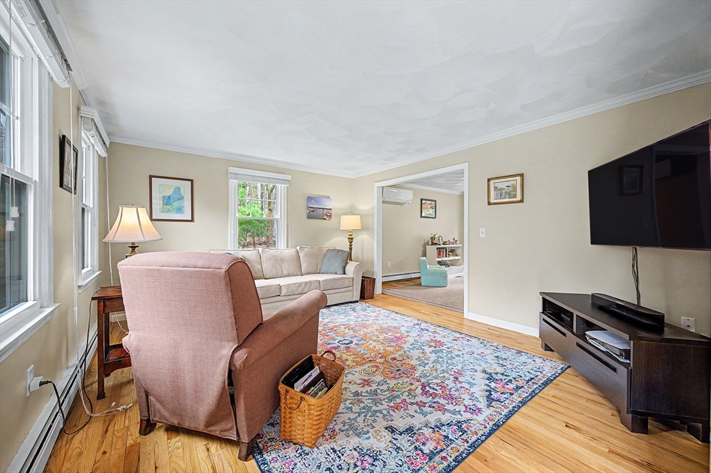 1 Coburn Road Hopkinton, MA 01748 - Photo 10 of 42 a living room with furniture and a flat screen tv