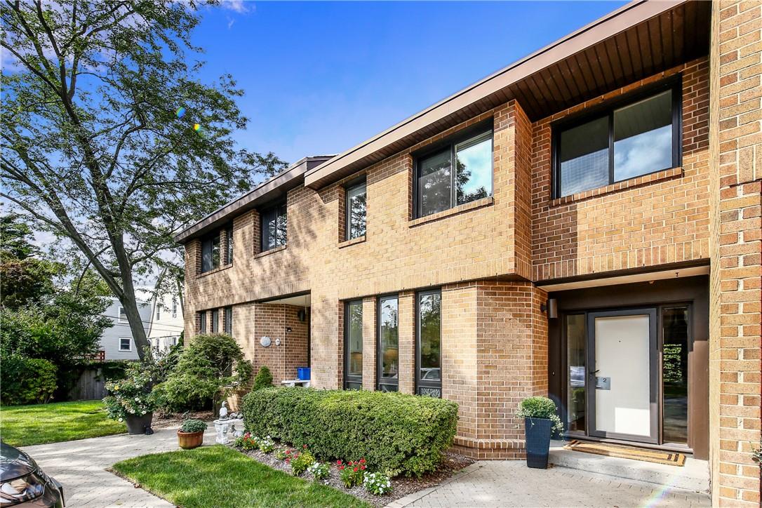 2 Waters Edge Rye, NY 10580 - Photo 1 of 1 a front view of a house with garden