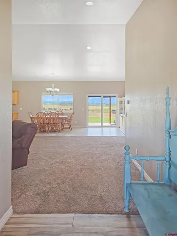 a bedroom with a large bed couch and a window