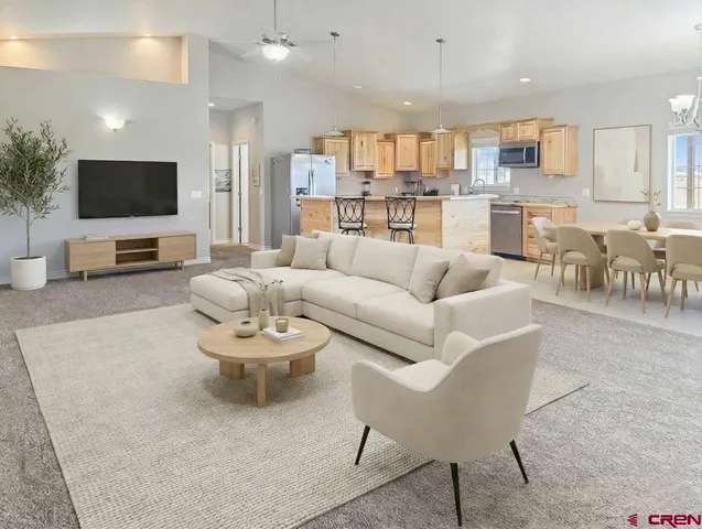 a bedroom with a bed and a dresser next to a window