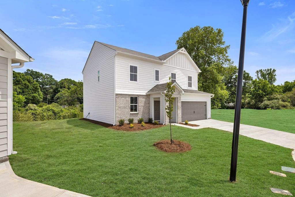 172 Sweet Water Lane Southeast Rome, GA 30161 - Photo 3 of 29 a front view of house with yard and green space