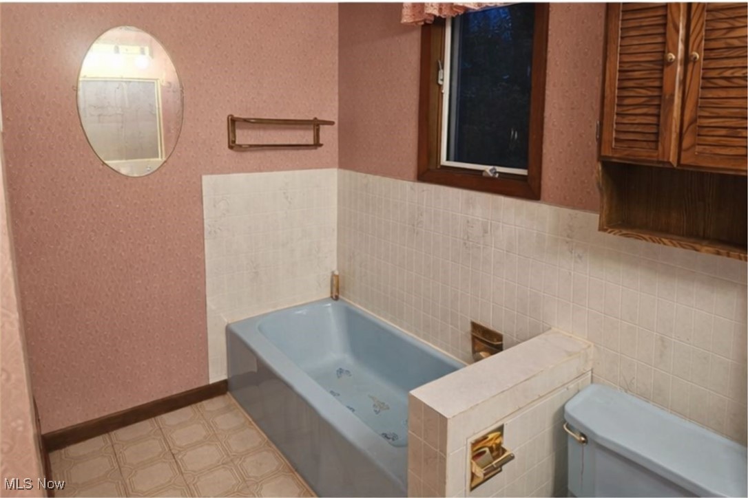 279 Coitsville Road Campbell, OH 44405 - Photo 15 of 20 Full bath with wallpapered walls, a garden tub, and light floors