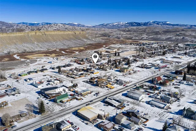 an aerial view of residential building and ocean view