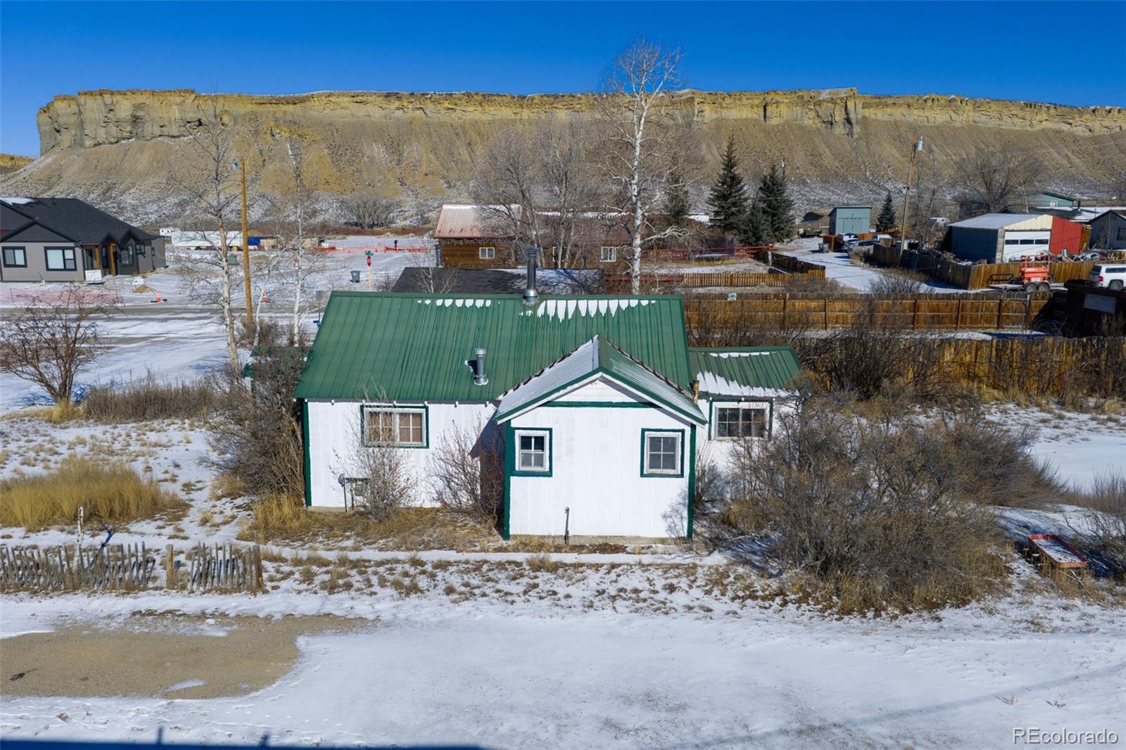 212 5th Street Kremmling, CO 80459 - Photo 6 of 10 a view of a house with a yard and sitting area