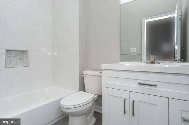 a bathroom with a sink toilet and a bathtub