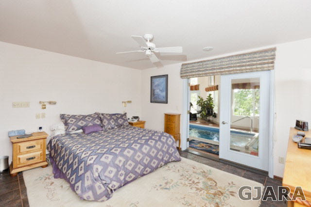2334 Sundial Road Grand Junction, CO 81505 - Photo 14 of 31 a bedroom with a bed and a dresser with mirror