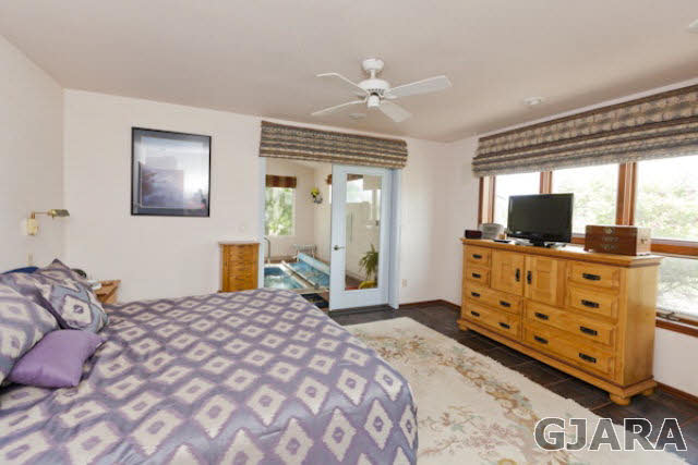 2334 Sundial Road Grand Junction, CO 81505 - Photo 15 of 31 a bedroom with a bed and wooden floor