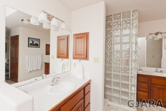 2334 Sundial Road Grand Junction, CO 81505 - Photo 17 of 31 a bathroom with a sink and a mirror