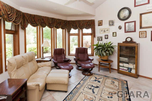2334 Sundial Road Grand Junction, CO 81505 - Photo 2 of 31 a living room with furniture and a floor to ceiling window