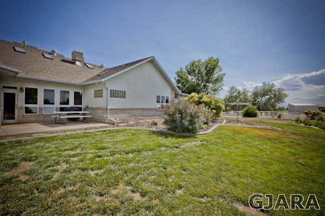 2334 Sundial Road Grand Junction, CO 81505 - Photo 26 of 31 a view of a house with a yard