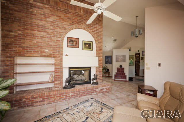 2334 Sundial Road Grand Junction, CO 81505 - Photo 3 of 31 a living room with furniture and a fireplace