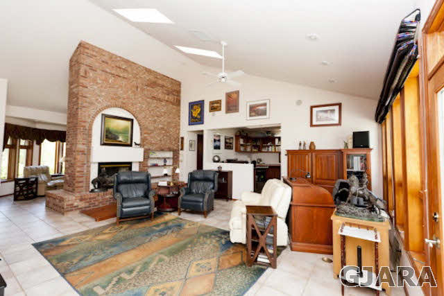 2334 Sundial Road Grand Junction, CO 81505 - Photo 4 of 31 a living room with fireplace furniture and a flat screen tv