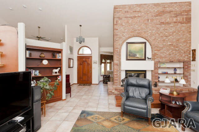 2334 Sundial Road Grand Junction, CO 81505 - Photo 5 of 31 a living room with furniture and a fireplace