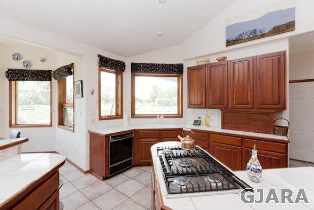 2334 Sundial Road Grand Junction, CO 81505 - Photo 8 of 31 a kitchen with stainless steel appliances granite countertop a sink stove and cabinets