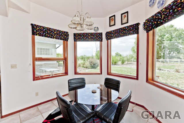 2334 Sundial Road Grand Junction, CO 81505 - Photo 10 of 31 a view of a dining room with furniture window and outside view