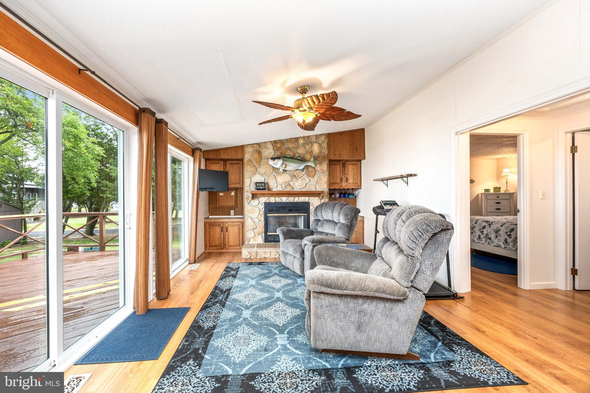 7940 Riverview Road Westover, MD 21871 - Photo 30 of 93 a living room with furniture and a large window