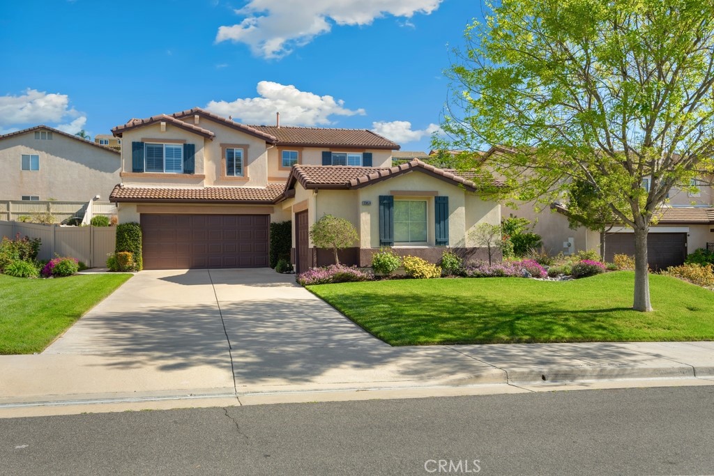 33859 Abbey Road Temecula, CA 92592 - Photo 1 of 1 a front view of a house with a garden and trees