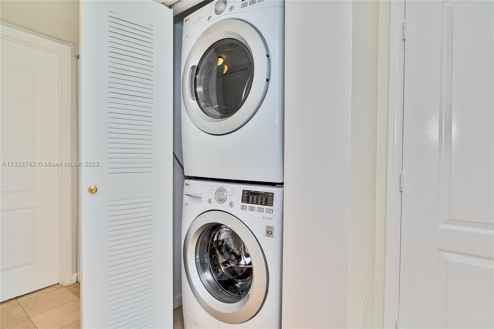 Brickell Miami, FL 33129 - Photo 14 of 44 a utility room with dryer and washer
