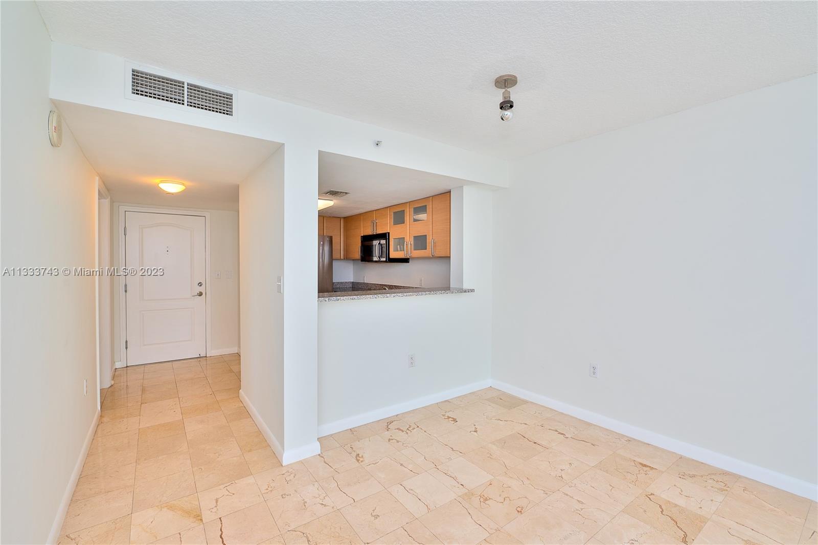 Brickell Miami, FL 33129 - Photo 2 of 44 a view of a big room with wooden floor and cabinet