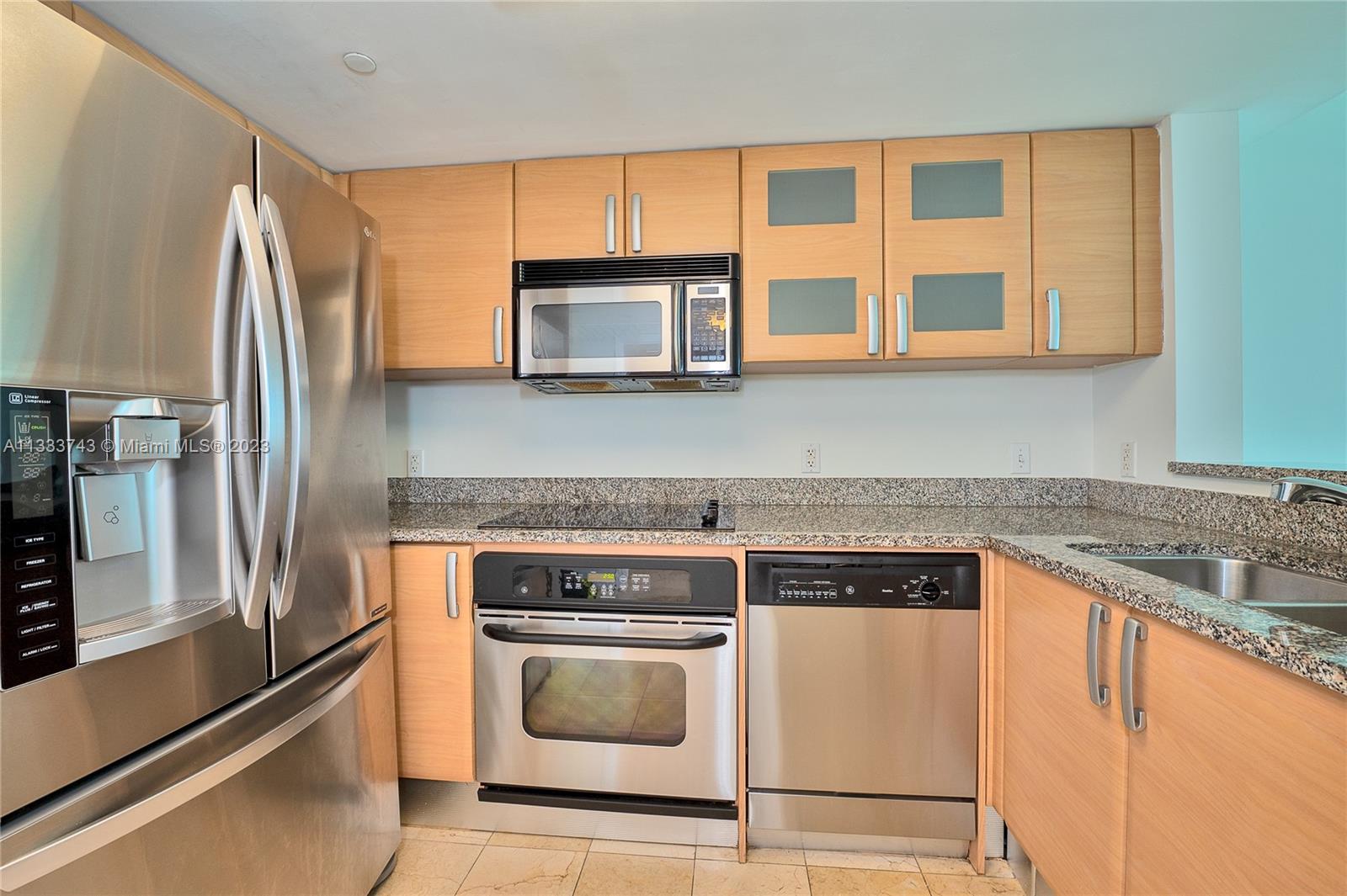 Brickell Miami, FL 33129 - Photo 4 of 44 a kitchen with a stove microwave and refrigerator