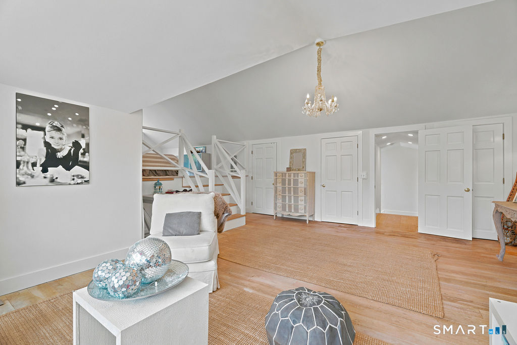 261-1 Grassy Hill Road Lyme, CT 06371 - Photo 26 of 40 Beyond its spacious layout and inviting character, this bedroom features three closets, providing abundant storage and everyday convenience.