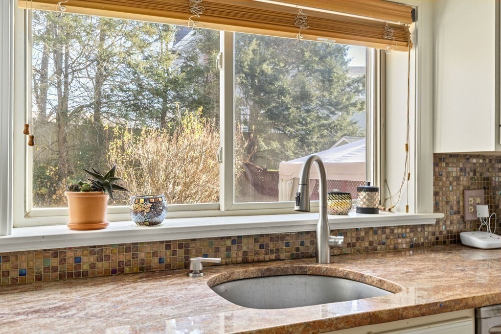 9 Lawrence Street Beverly, MA 01915 - Photo 11 of 42 a kitchen with a sink and a large window