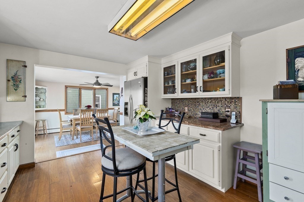 9 Lawrence Street Beverly, MA 01915 - Photo 13 of 42 a view of a dining room with furniture and wooden floor
