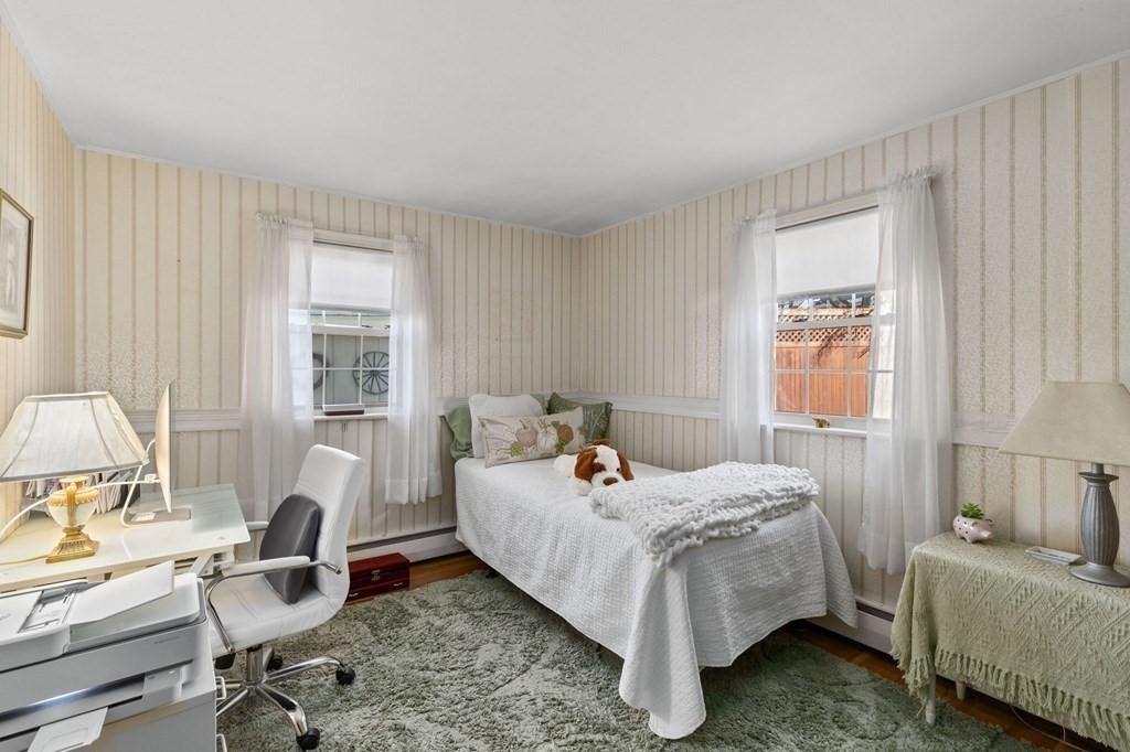 9 Lawrence Street Beverly, MA 01915 - Photo 18 of 42 a bed room with a bed and a window