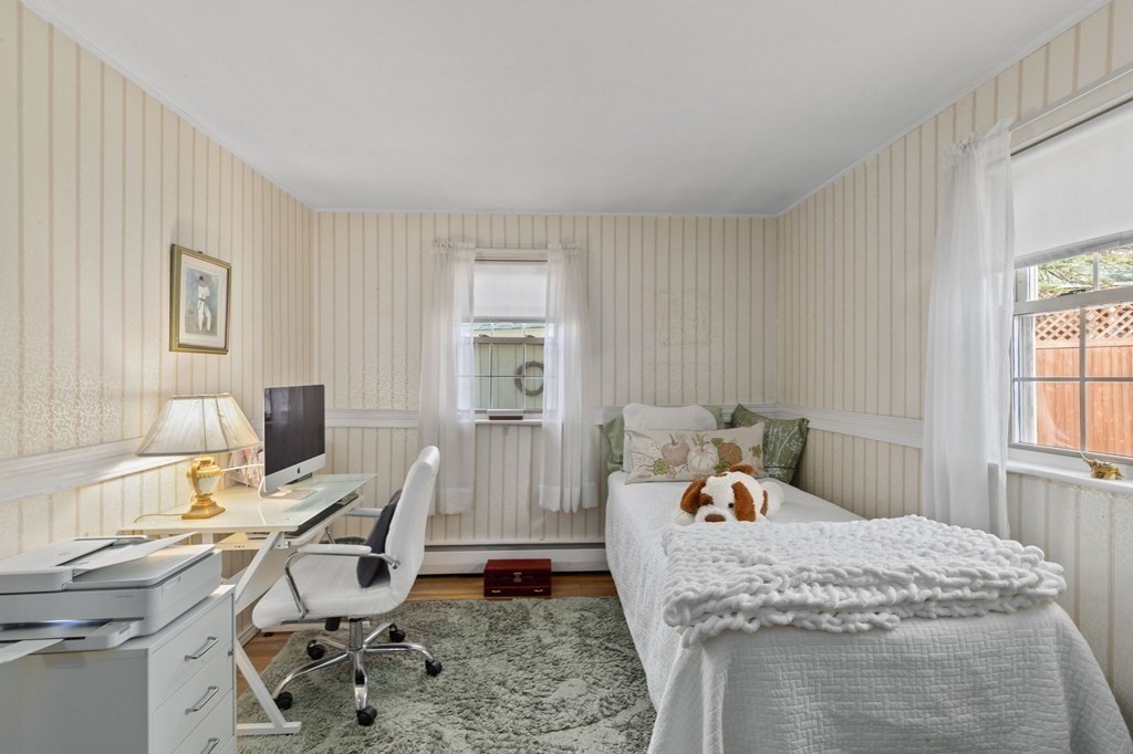 9 Lawrence Street Beverly, MA 01915 - Photo 19 of 42 a bedroom with a bed and large window