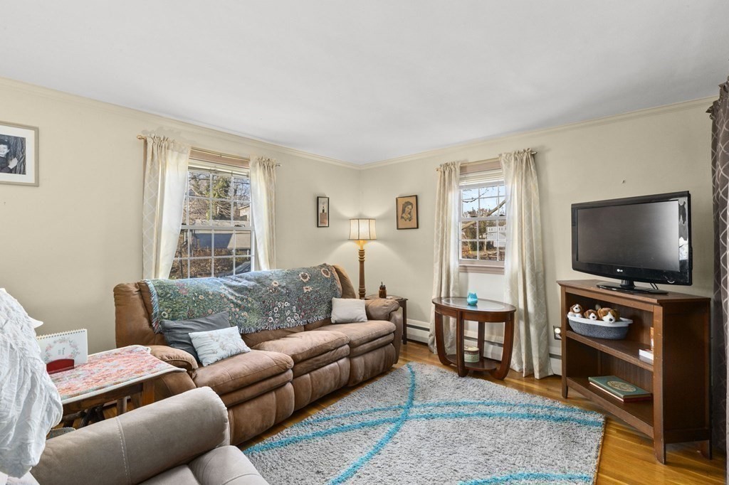 9 Lawrence Street Beverly, MA 01915 - Photo 20 of 42 a living room with furniture and a flat screen tv