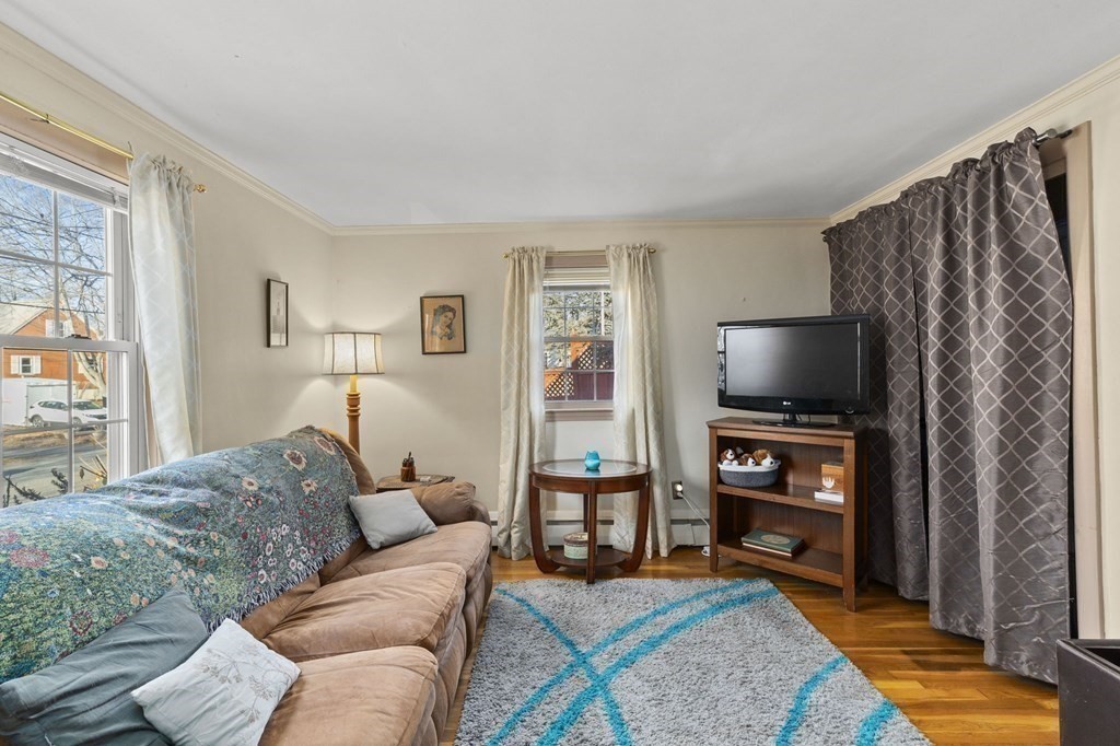 9 Lawrence Street Beverly, MA 01915 - Photo 21 of 42 a living room with furniture and a flat screen tv