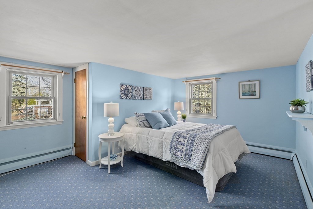 9 Lawrence Street Beverly, MA 01915 - Photo 22 of 42 a bedroom with a bed and a window