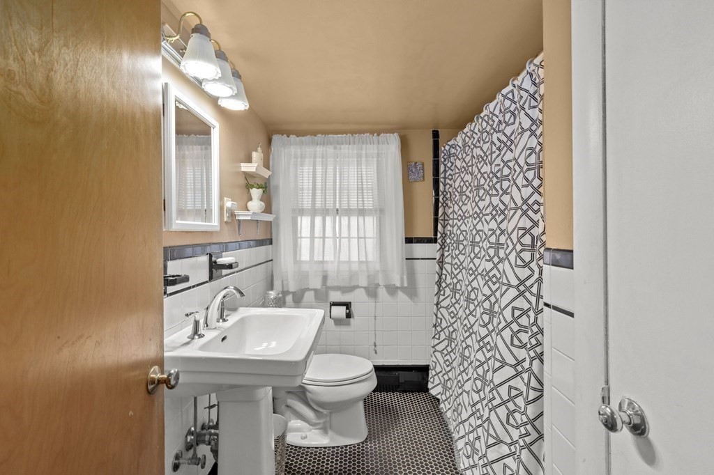 9 Lawrence Street Beverly, MA 01915 - Photo 23 of 42 a bathroom with a sink toilet and shower