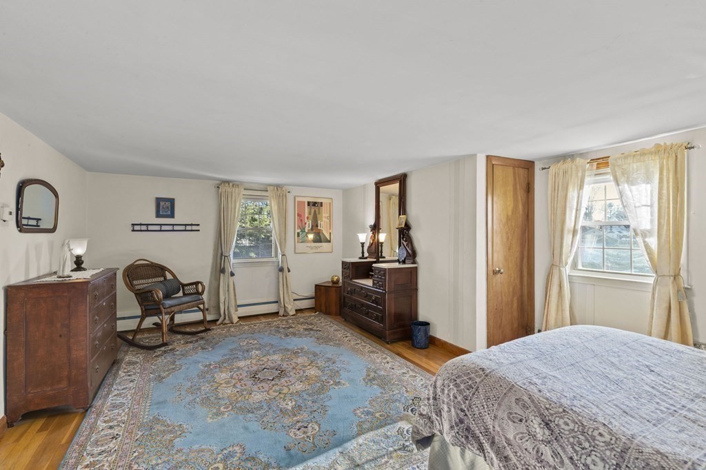 9 Lawrence Street Beverly, MA 01915 - Photo 25 of 42 a bedroom with a bed and a chair