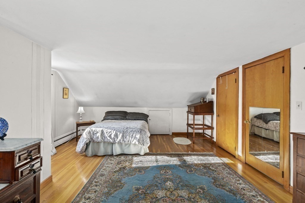 9 Lawrence Street Beverly, MA 01915 - Photo 26 of 42 a bedroom with a bed and a window